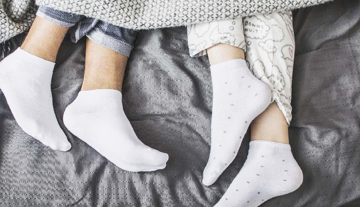 sleeping with socks in winter,is it safe to wear socks while sleeping in winter,benefits and risks of wearing socks to bed,winter sleep habits,wearing socks to bed health risks,winter foot care tips,effects of sleeping with socks on,should you wear socks while sleeping in winter,pros and cons of wearing socks while sleeping,socks in winter sleep tips