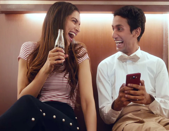 new coco cola commercial of deepika pdukone,deepika enjoying in lift. deepika dancing with a waiter,coco-cola new advertisement,deppika pdukone advertisements