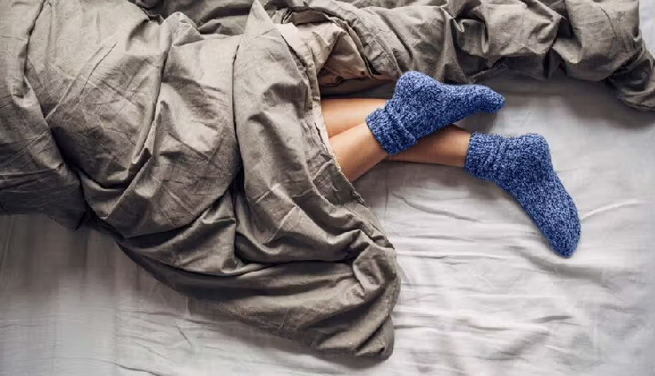 sleeping with socks in winter,is it safe to wear socks while sleeping in winter,benefits and risks of wearing socks to bed,winter sleep habits,wearing socks to bed health risks,winter foot care tips,effects of sleeping with socks on,should you wear socks while sleeping in winter,pros and cons of wearing socks while sleeping,socks in winter sleep tips